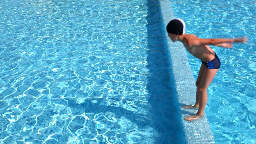 Boy stood on parapet prepared and jumped into the water