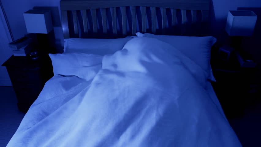 Timelapse of man fitfully sleeping