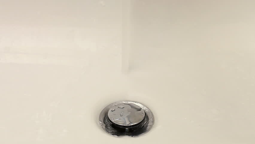 Water in white sink plug