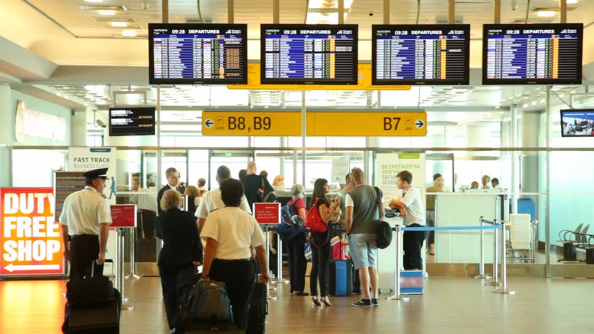 PRAGUE - JULY 16: People pass passport control on exit to gates of Ruzyne airport, July 16, 2010 in Prague, Czech Republic. Ruzyne is the biggest airport in middle and eastern Europe. 