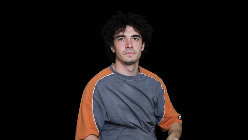 Portrait of an adult young man having a dialog with an off character. Alpha matte included. 