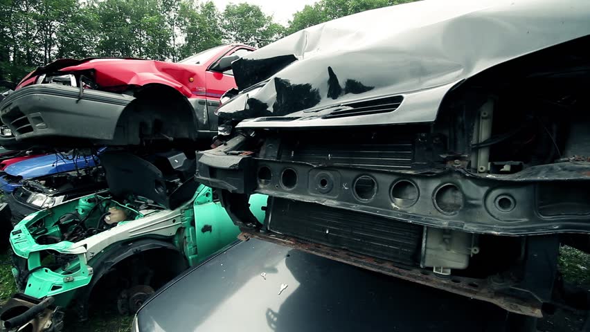 damaged cars in a junkyard where parts can be recycled