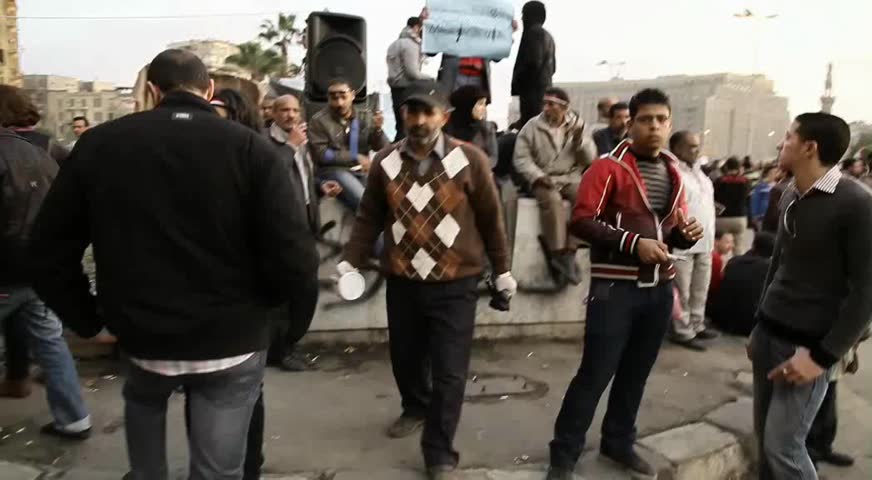 CAIRO - CIRCA FEB 2011: Man cleans Tahir Square st. after Egyptian Revolution circa February 2011, Cairo, Egypt. Tahrir Square was the focal point of the 2011 Egyptian Revolution where demonstrations grew to 250,000 plus people by day 6, January 31, 2011.
