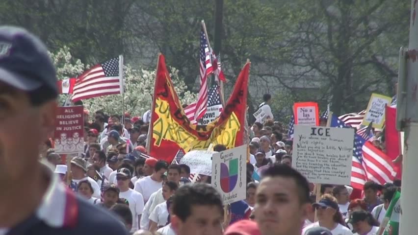 Chicago 2007 Immigration March with thousands of people, signs, and flags.