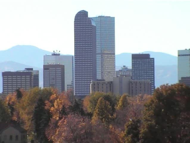 Denver skyline and Rocky mountains viewed from City Park