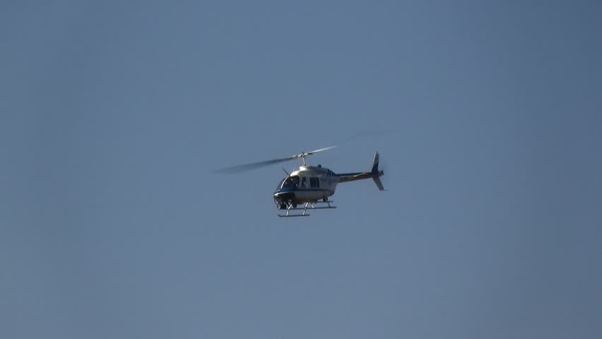 MOUNT CARMEL, ISRAEL - DECEMBER 12: Israeli police helicopter in assignment during the fire storm on Mount Carmel, Israel December 12, 2010