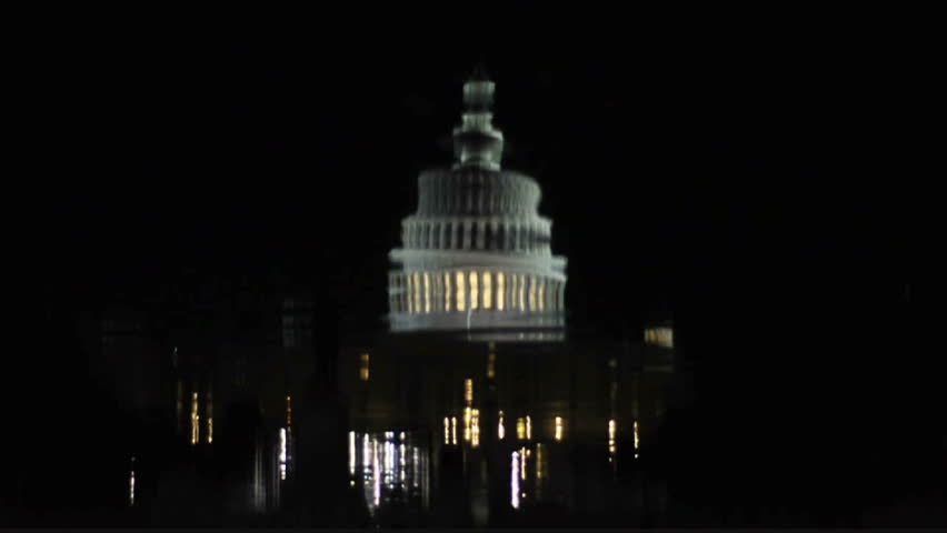 View of the Capitol building and the reflecting pool at night in Washington D.C. circa 2009