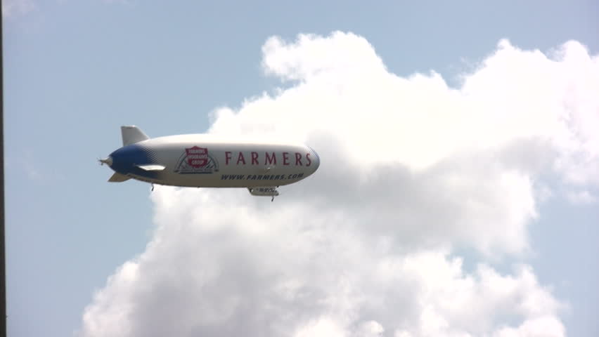 FORT LAUDERDALE, USA - MAY 20: The Farmers Airship Eurika visits South Florida on a nationwide tour. The zeppelin bears the name of Farmers Insurance as a sponsor on May 20, 2011 near Fort Lauderdale, FL 
