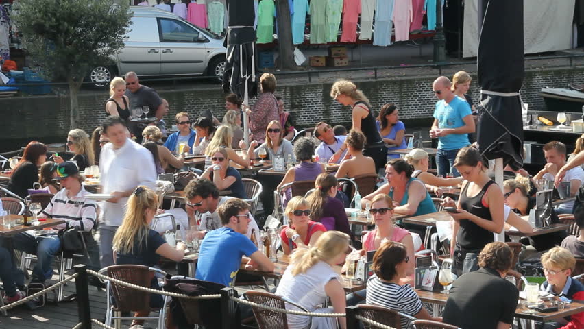LEIDEN, HOLLAND - SEPTEMBER 24: People dining on cafe terrace, September 24, 2011, Leiden, Holland.  In addition to the (legal) sale of cannabis, the majority of 'licenced' coffeeshops in the Netherlands also serve drinks and food.