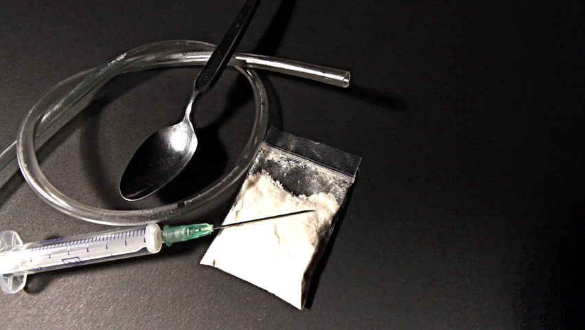Hard drug - addiction concept. ILLUSTRATION! The white powder is flour before anyone think something else :-)  Studio setup with professional lighting and dolly motion.