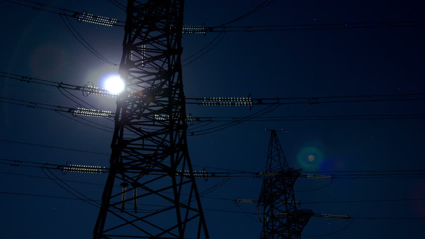 Electricity pylon and moving moon.