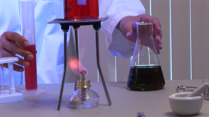 series of a laboratory technician working  shot with blue and red gels
