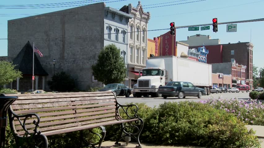 A park bench and Main Street in the all American town of Ottawa Kansas.