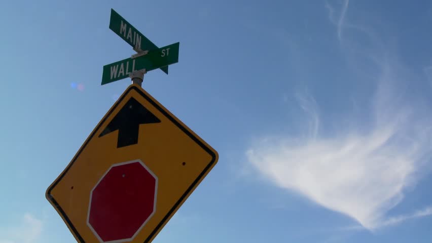 A street sign indicates the intersection of Main and Wall Streets.