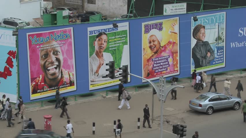 NAIROBI, KENYA - CIRCA 2009:  Handprinted billboard signs along a busy street circa 2009 in Nairobi, Kenia.