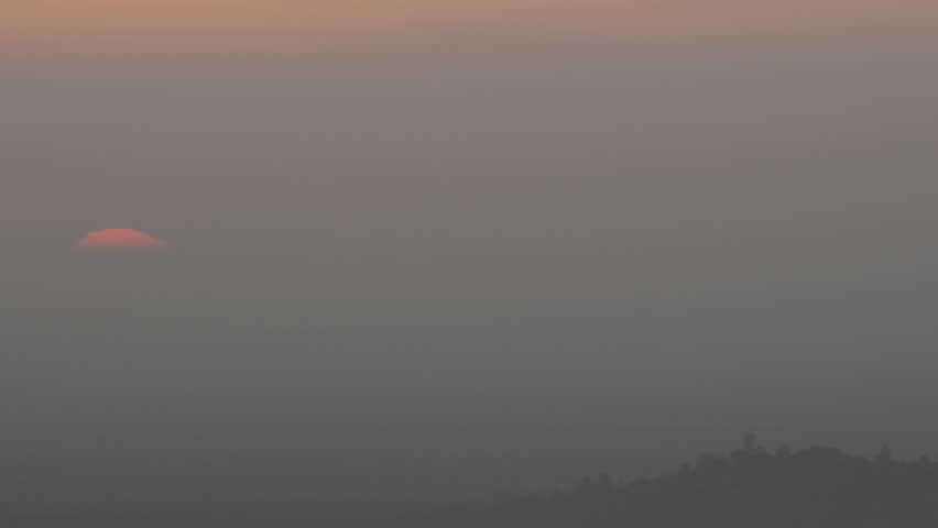Time lapse of sun rising through the haze from Mount Hollywood in Griffth Park near Hollywood, California.