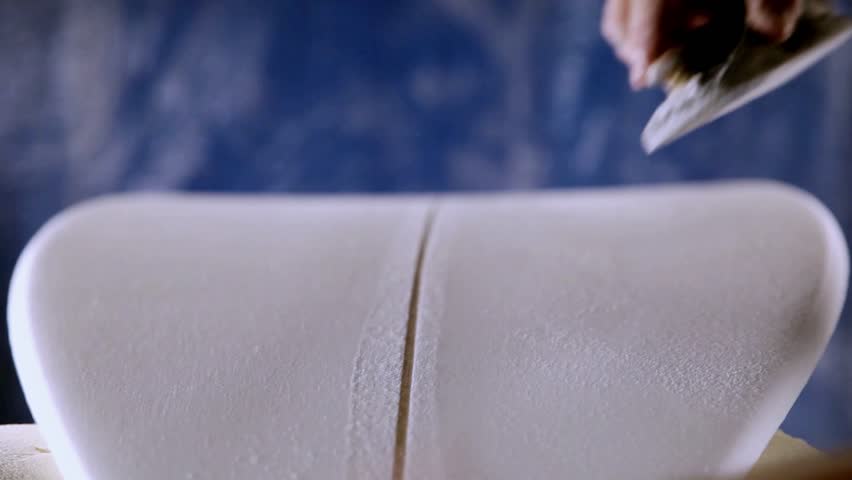 Shaving/cleaning a new surfboard