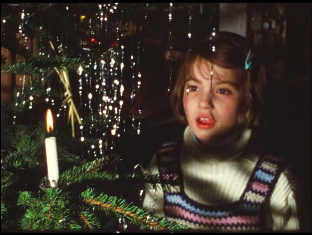 Girl blowing out Christmas tree candle (Vintage 8 mm amateur film)