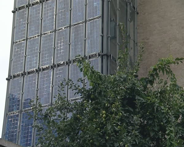 Lot of solar collectors installed on the building walls in Denmark.  Renewable energy. 