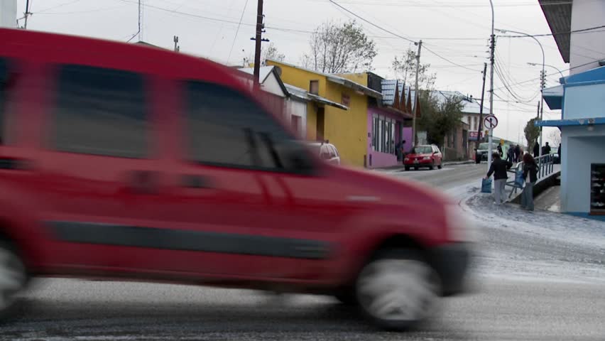 PATAGONIA, SOUTH AMERICA - CIRCA 2009: People walk on the streets of an Argentinean or Chilean town in winter circa 2009 in Patagonia.