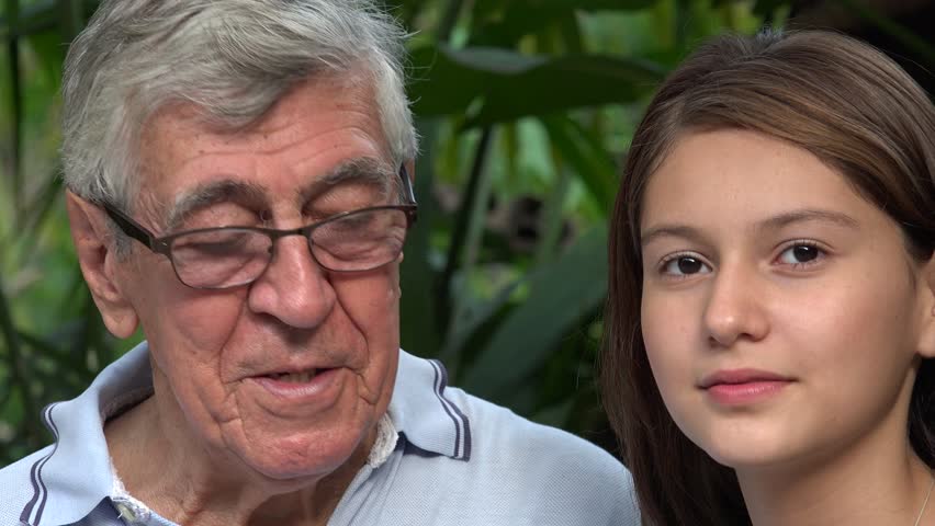 Old man teaches young girl