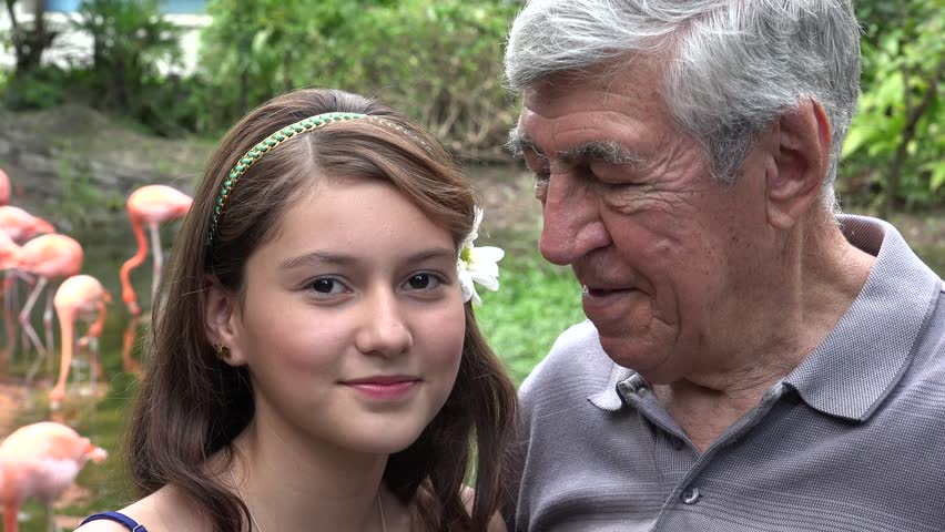 Old man teaches young girl