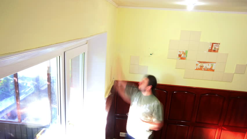 master applies decorative plaster on the wall. Timelapse. 