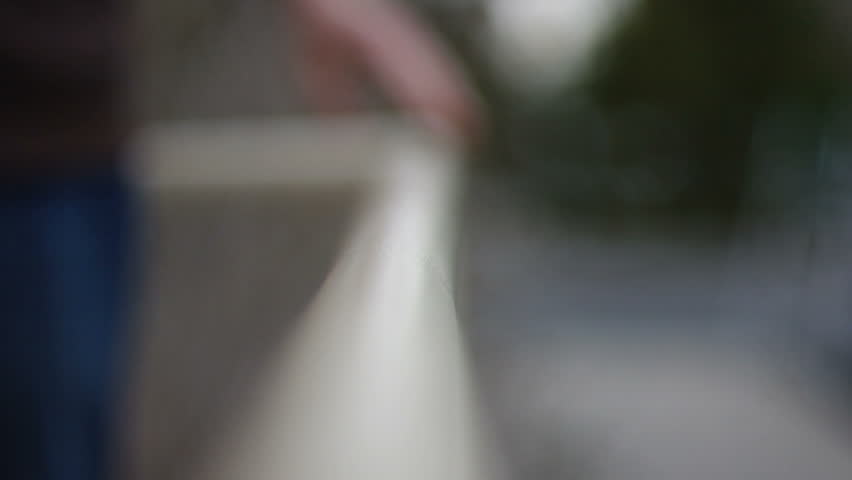 Hands on a railing