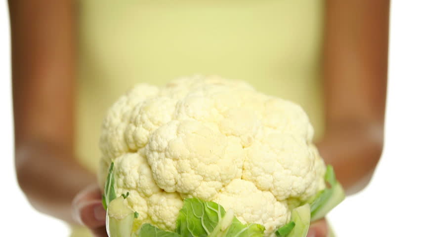 Cauliflower. Woman showing holding Cauliflower isolated on white background.