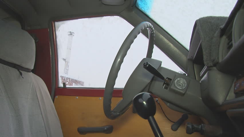 Man tries to start a truck in a snowstorm but has nothing but frustration.