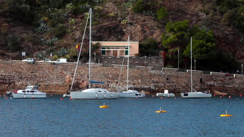 Boats At Porto Azzurro, Elba Island - Sailboats moored in the small marina of Porto Azzurro, Elba Island, Italy.