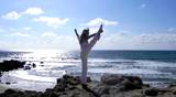 Fitness - Women exercise healthy peaceful Yoga lifestyle meditate meditating beach