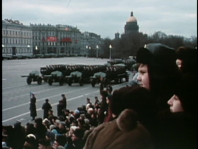 MOSCOW, RUSSIA - CIRCA 1970: Troops parade with tanks and bombs at an old Soviet military event.