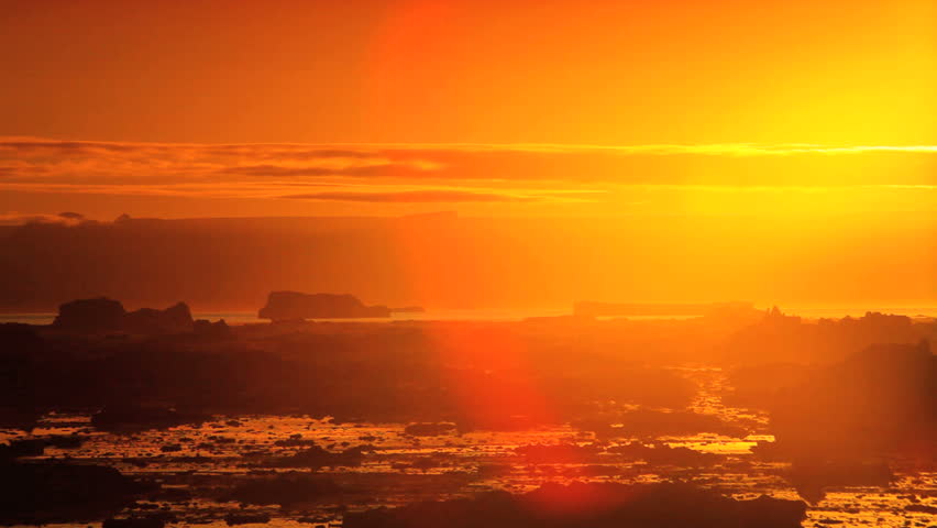 Glow of SettFng Sun over Melting Ice floes