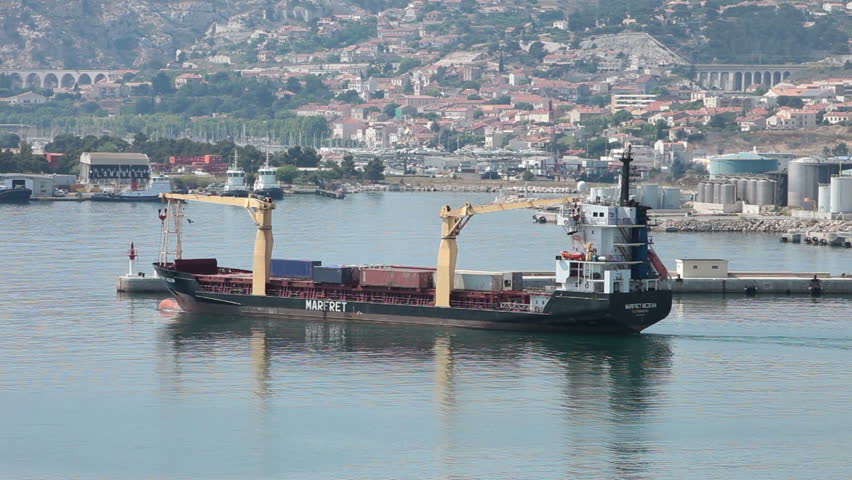 MARSEILLE, FRANCE MAY 23: Cargo ship departing port into Mediterranean Sea May 23 2011 in Marseille France 