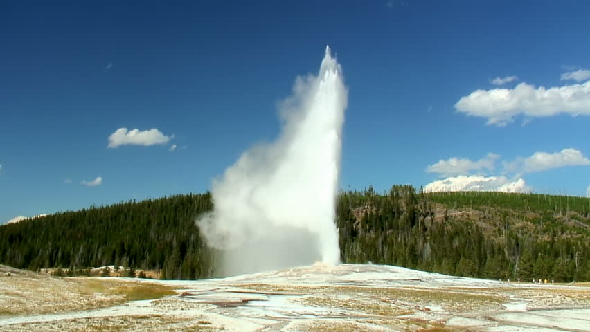 Old Faithful geyser erupting in Yellowstone National Park 