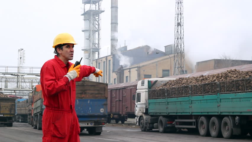 Factory Worker. Trucks loaded with sugar beet ready for delivery in sugar refinery. HD 1080i.