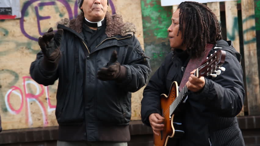 TORONTO, ONTARIO - NOV 23th: Protesters sing at Occupy Toronto on Nov 23rd, 2011, Toronto, Ontario, Canada. The site was closed down on Nov 23rd by police following a superior court judge ruling.