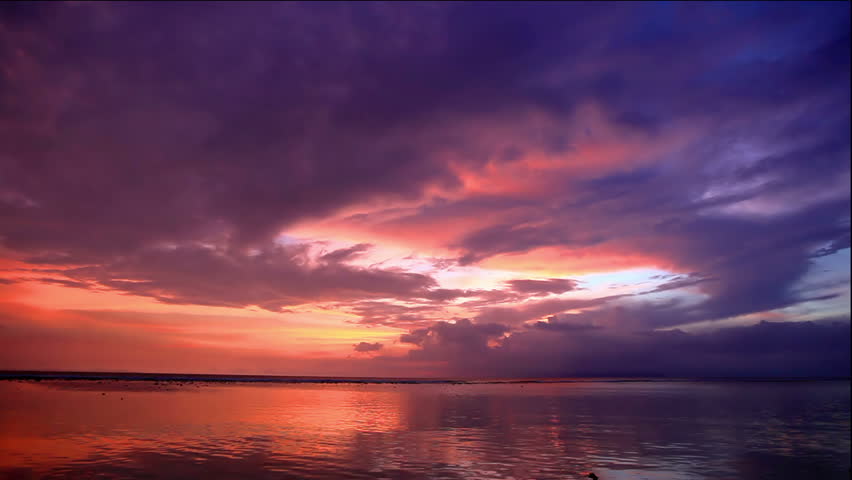 Tropic sunset over Bali as seen from Gili island