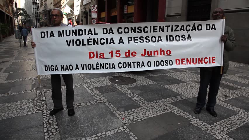 SAN PAULO, BRAZIL - CIRCA JUNE 2011: Demonstrators hold up banners protesting discrimination and violence against females and elderly circa June 2011 in San Paulo.
