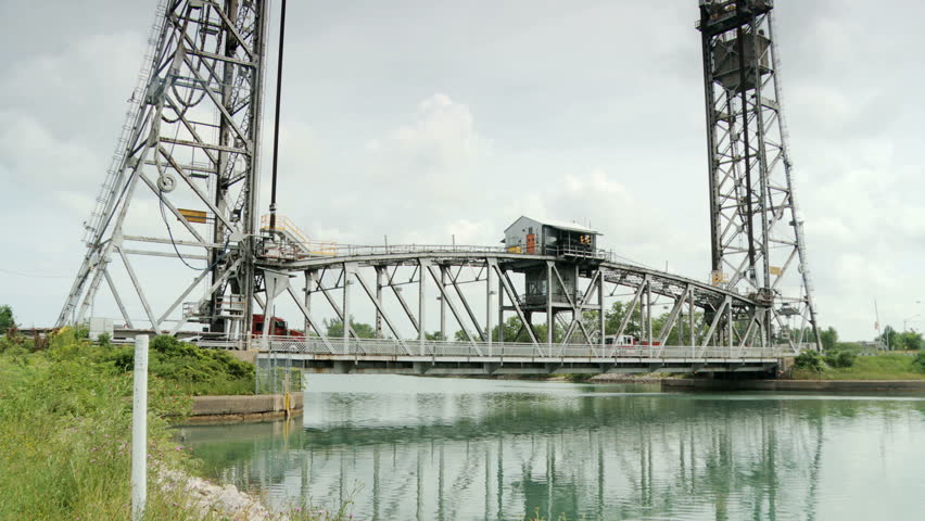 Traffic across Lift Bridge.  Traffic moving across Vertical Lift Bridge on the Welland Canal at Welland, Ontario, Canada.