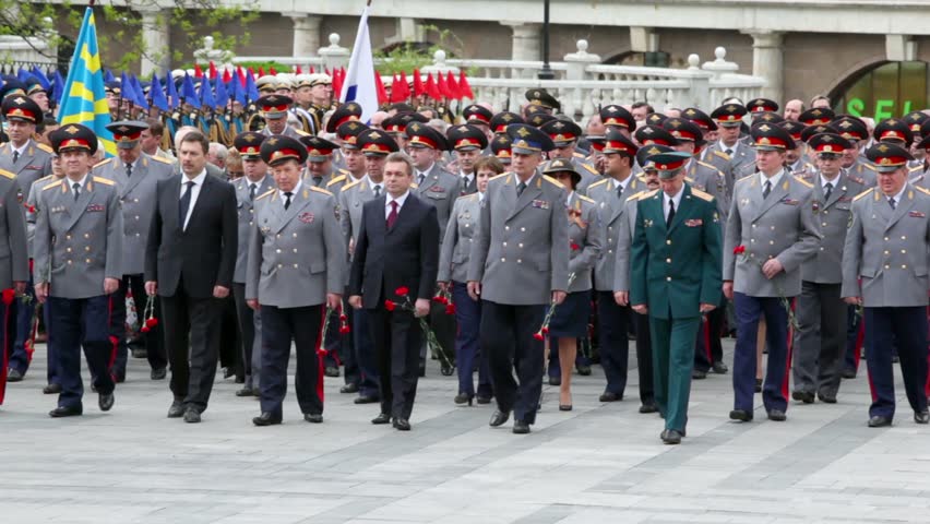 MOSCOW - MAY 8: Soldiers carry garland on wreath laying ceremony, many Interior Ministry officials walk behind on May 8, 2011 in Moscow, Russia
