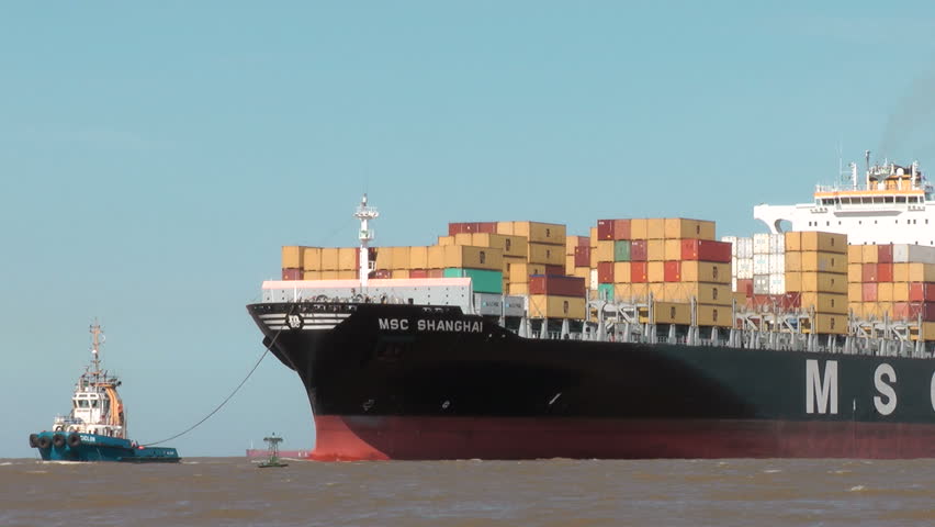 BUENOS AIRES - DEC 6: The cargo ship MSC Shanghai approaches the harbor of Buenos Aires, Argentina, on December 6, 2011. MSC S.A. is a global shipping line based in Switzerland.