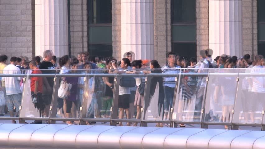 SHANGHAI - CIRCA AUGUST, 2011: people on an overpass bridge