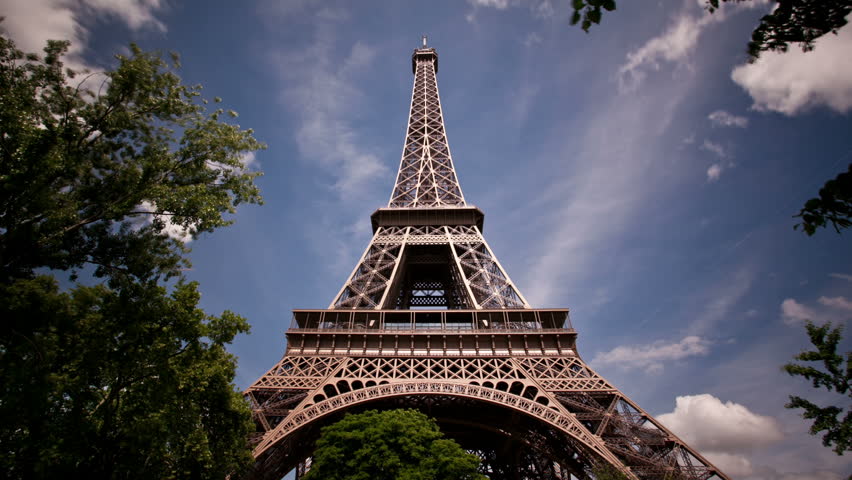 Daytime timelapse of clouds looking up at the Eiffel Tower