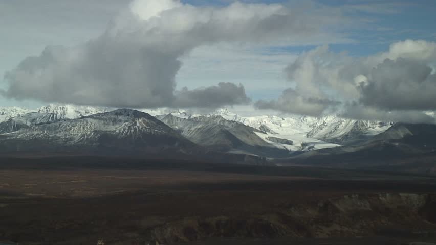 Stark Shadows Of Low Clouds Over Mountains