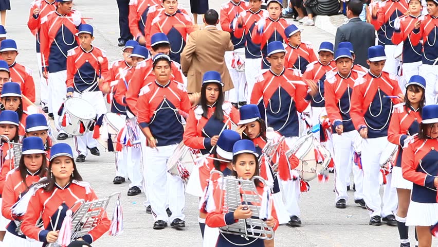 BANOS DE AGUA SANTA, ECUADOR - DECEMBER 16: Young students march in a parade for the anniversary of the cantonization of the city of Banos de Agua Santa, Ecuador on December 16, 2011.