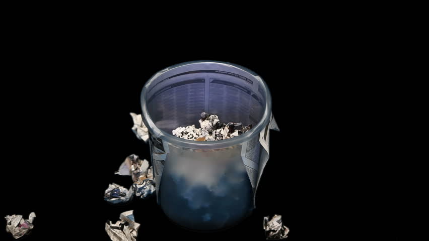 Time lapse of filling a trash bin with paper rubbish. 