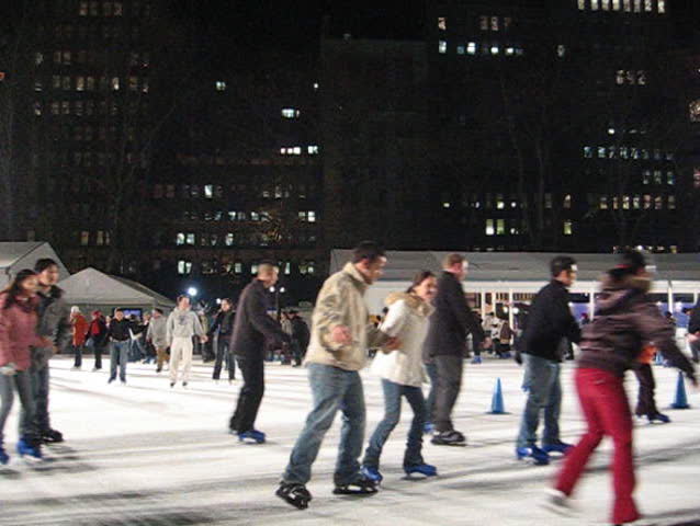 people ice skating, bryant park, nyc