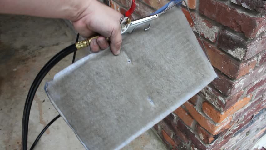Filter being cleaned with compressed air